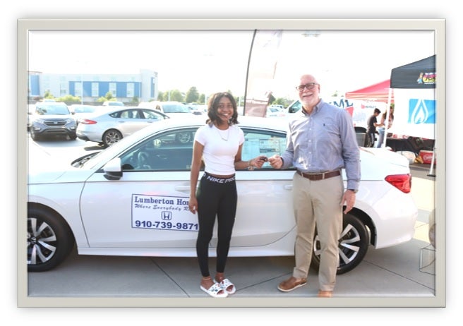 image of a man shaking hands with a woman in the community