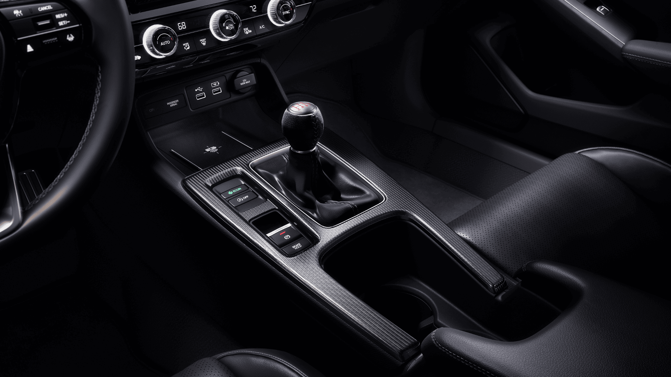 Interior of the 2024 Honda Civic Hatchback featuring manual gear shift.
