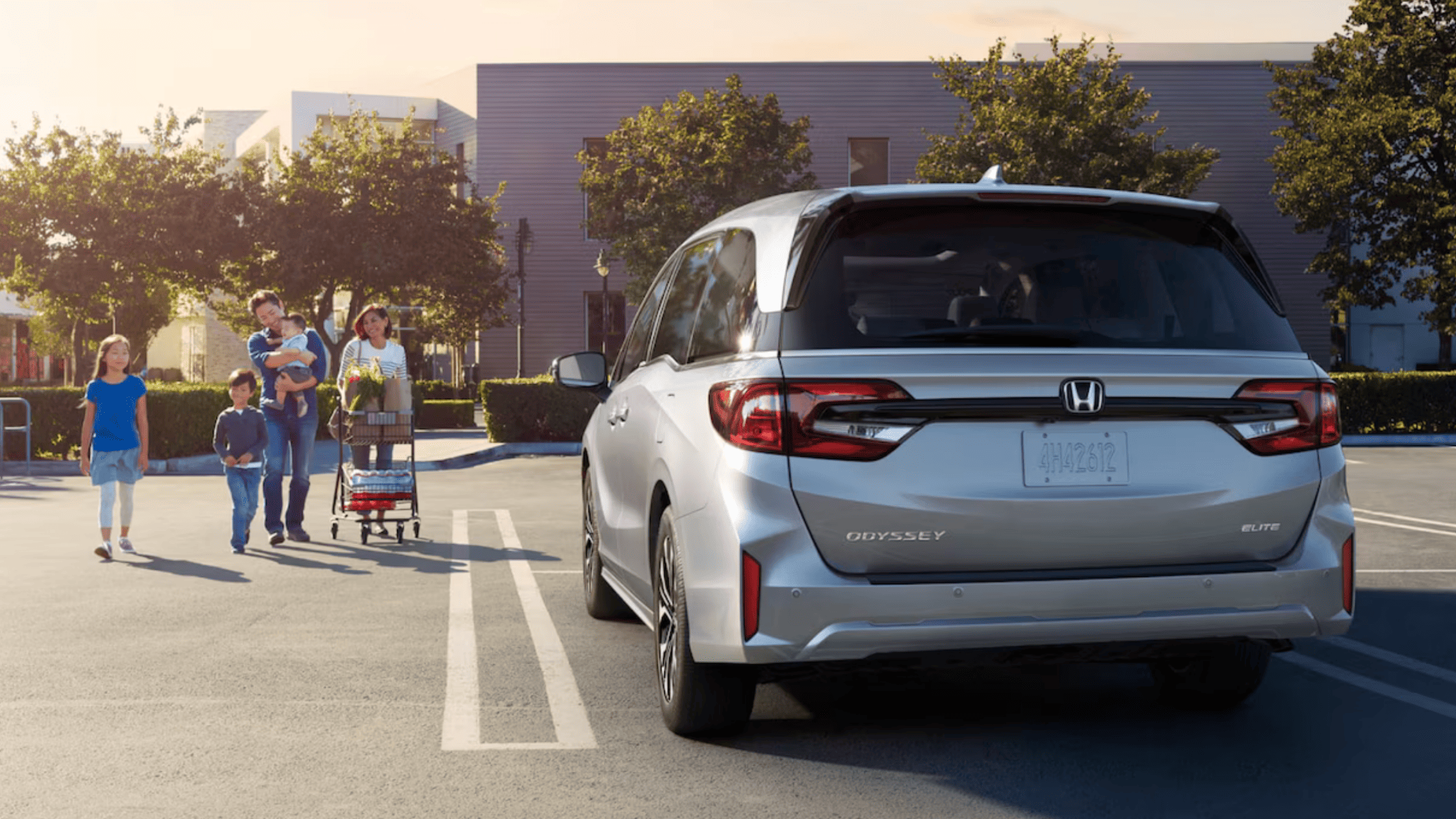 Honda Odyssey's dashboard with touchscreen, climate controls, and start button.