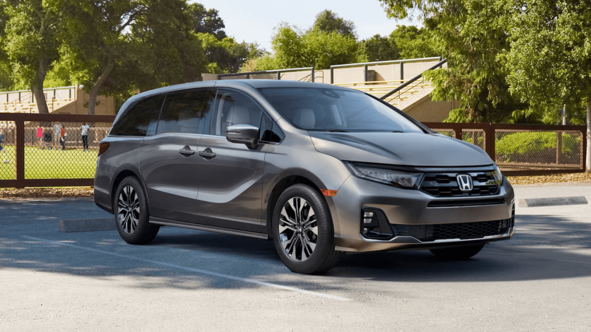 Honda Odyssey interior showing folded seats and spacious rear cabin area.